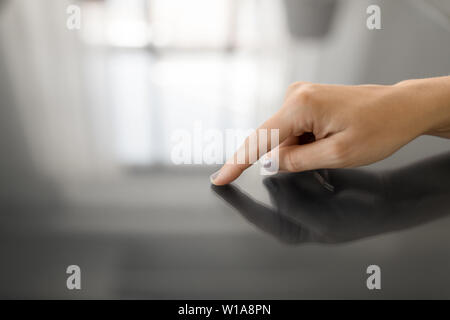 hand using black interactive panel Stock Photo
