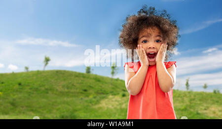 surprised or scared little african american girl Stock Photo