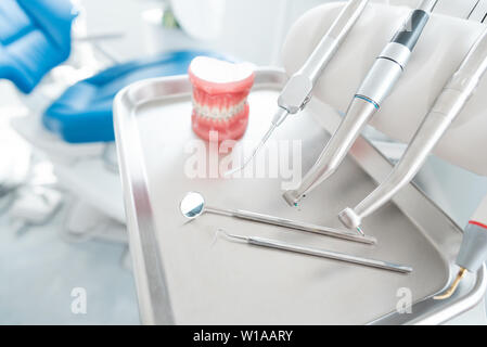 Dental drills and jaw model in dentists office. Dentistry, dental care,healthy teeth concept Stock Photo