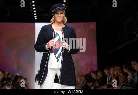 Berlin, Germany. 01st July, 2019. A model presents the fashion of the designer Guido Maria Kretschmer in the E-Werk. The collections for Spring/Summer 2020 will be presented at Berlin Fashion Week. Credit: Monika Skolimowska/dpa/Alamy Live News Stock Photo