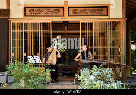 Los Angeles, USA. 30th June, 2019. Chinese musicians perform during the Summer Family Festival 2019 in Los Angeles, the United States, June 30, 2019. The festival held in Storrier Stearns Japanese Garden features art and music from China, Japan and South Korea. Credit: Li Ying/Xinhua/Alamy Live News Stock Photo