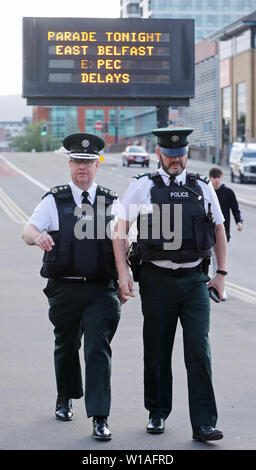 New PSNI Chief Constable Simon Byrne (left) on a walk about in east Belfast on his first day in office. Stock Photo