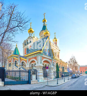 VIENNA, AUSTRIA - FEBRUARY 18, 2019: The beautiful Orthodox Church in typical Russian style with golden onion domes and colorful tiled roof of the mai Stock Photo