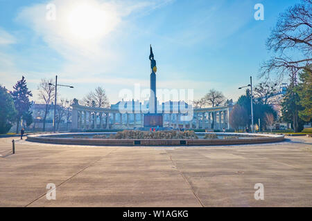 VIENNA, AUSTRIA - FEBRUARY 18, 2019: The high column with figure of a Red Army Soldier and semi-circular white marble colonnade of Soviet War Memorial Stock Photo