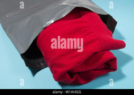 mailing bag on blue background Stock Photo