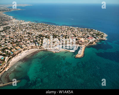 Aerial image drone point of view turquoise bay of Mediterranean Sea waters and coastline Cabo Roig Torrevieja from above at summer, Province of Alican Stock Photo