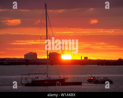 Queenborough, Kent, UK. 1st July, 2019. UK Weather: a dramatic sunset in Queenborough, Kent at the end of another warm day in the South East. Credit: James Bell/Alamy Live News Stock Photo