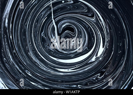 abstract image mixing of two colors. The texture of the circles of white and black paint Stock Photo