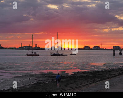 Queenborough, Kent, UK. 1st July, 2019. UK Weather: a dramatic sunset in Queenborough, Kent at the end of another warm day in the South East. Credit: James Bell/Alamy Live News Stock Photo