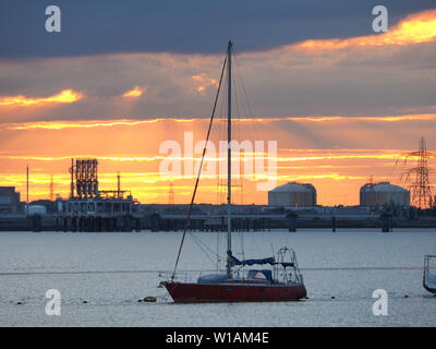 Queenborough, Kent, UK. 1st July, 2019. UK Weather: a dramatic sunset in Queenborough, Kent at the end of another warm day in the South East. Credit: James Bell/Alamy Live News Stock Photo