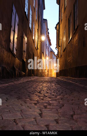 Beautiful empty lit streets on the island of Gamla Stan - Stockholm's Old Town medieval city centre. Stock Photo