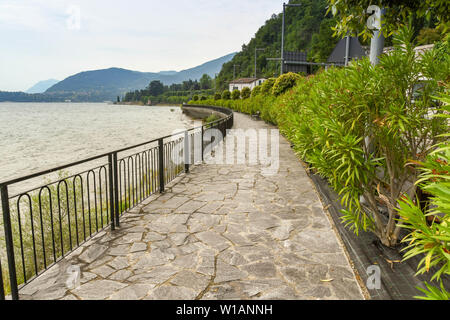 LAKE COMO, ITALY - JUNE 2019: The walking path near Menaggio on the trail which runs for several miles around Lake Como - the Greenway del Lago di Com Stock Photo