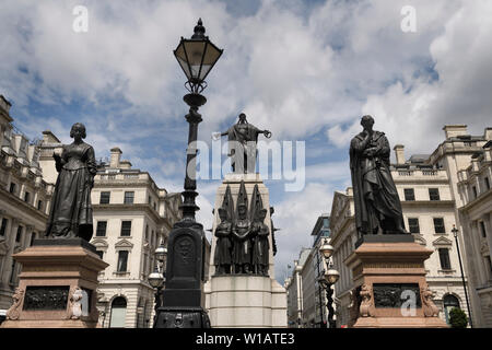 Monument to Florence Nightingale and Sidney Herbert Secretary at War for the Crimean War with lamp post and War Memorial Waterloo Place London England Stock Photo