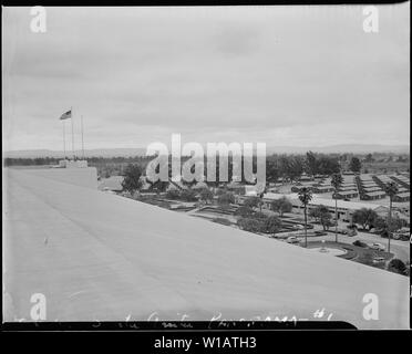 Arcadia, California. Bird's-eye view of quarters for evacuees of Japanese ancestry at Santa Anita a . . .; Scope and content:  The full caption for this photograph reads: Arcadia, California. Bird's-eye view of quarters for evacuees of Japanese ancestry at Santa Anita assembly center. Evacuees will be transferred later to War Relocation Authority centers for the duration. Stock Photo