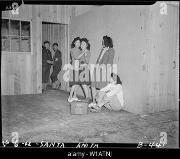 Arcadia, California. Impromptu dancing at Santa Anita assembly center for evacuees of Japanese ance . . .; Scope and content:  The full caption for this photograph reads: Arcadia, California. Impromptu dancing at Santa Anita assembly center for evacuees of Japanese ancestry. Evacuees are transferred later to War Relocation Authority centers for the duration. Stock Photo