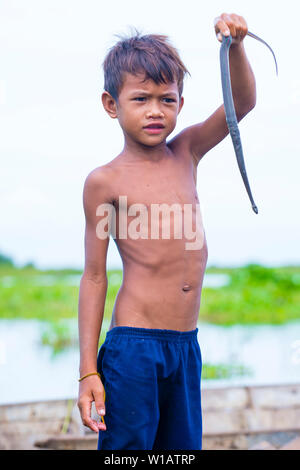 Young fisherman at the Tonle sap lake Cambodia Stock Photo - Alamy