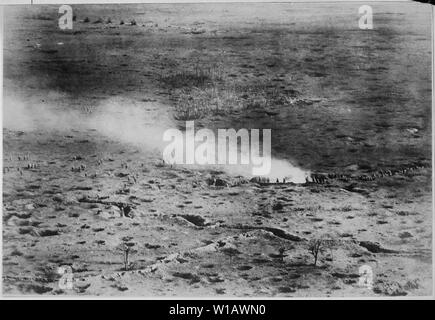 At a height of 150 meters above the fighting line, the daring French photographer was able to get this rare photograph of French troops on the Somme Front, launching an attack on the Germans. French Pictorial Service., ca. 1916 - ca. 1918; General notes:  Use War and Conflict Number 643 when ordering a reproduction or requesting information about this image. Stock Photo