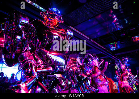 Giant silver robots and performers at the Robot Restaurant, Tokyo, Japan Stock Photo