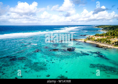 Aerial drone view at luxury resorts and coastline at Belle Mare beach on island Mauritius. Toned image. Stock Photo