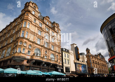 Red stones of Victory House at Leicester Square and Hippodrome Casino on Cranbourn street City of Westminster London England Stock Photo