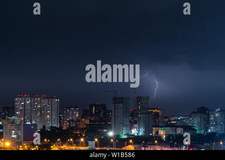 Thunder, lighting and storm in dark night sky. Stock Photo