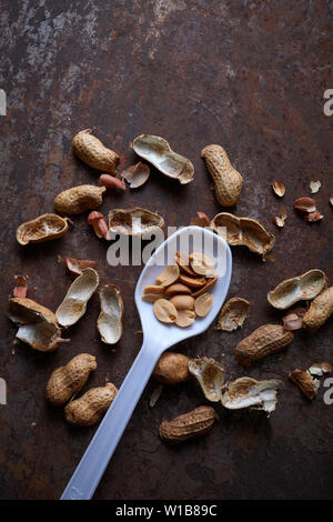 Peeled peanut on the rusty metal floor Stock Photo - Alamy