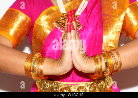 Female hands of professional Indian dancer demonstrates dance mudra (gesture) of Bharatanatyam classical dance in closeup view Stock Photo