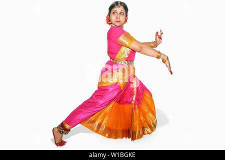 Young beautiful Indian woman dancer performing Bharatanatyam classical dance posture isolated on white background Stock Photo