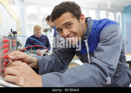 portrait of technician removing server cables Stock Photo