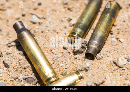 Used ammunition casings lay on the ground during a reunion for 2nd Battalion, 7th Marine regiment, 1st Marine Division at Range 101A, Marine Corps Air Ground Combat Center, Twentynine Palms, Calif., June 20, 2019. A marksmanship event was held during the reunion so past service members could fire updated weapons. (U.S. Marine Corps photo by Lance Cpl. Colton Brownlee) Stock Photo