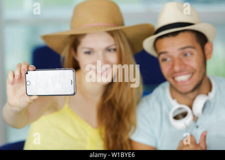 a young couple taking selfies Stock Photo