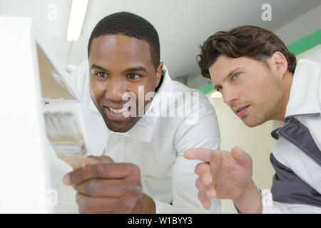 a painter with an apprentices Stock Photo