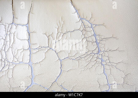 Cracked old leatherette fabric, Broken pattern texture background, Close up Stock Photo