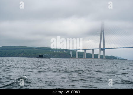 A line of modern russian military submarine cruisers in the row, northern fleet and baltic sea fleet in the open sea, submarine. Stock Photo