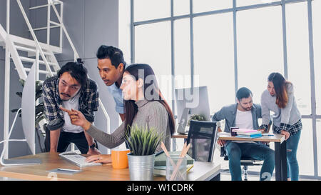 Creative designe team brainstrom branding project with designer team at meeting table with desktop computer.discussion idea in creative office Stock Photo