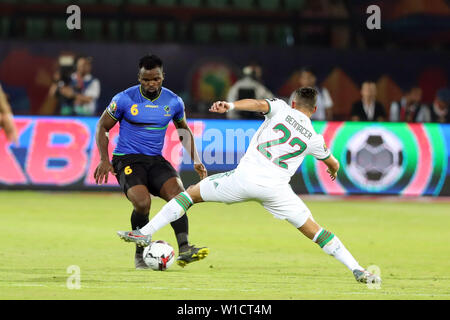 Cairo, Egypt. 1st July, 2019. Ismael Bennacer (R) of Algeria vies with David Patson Mwantika of Tanzania during the 2019 Africa Cup of Nations group C match in Cairo, Egypt, July 1, 2019. Credit: Ahmed Gomaa/Xinhua/Alamy Live News Stock Photo