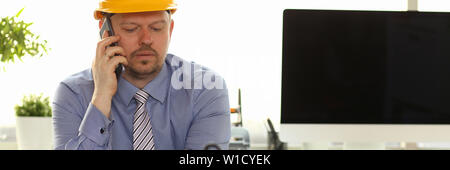 Caucasian Engineer Working on House Blueprint Stock Photo