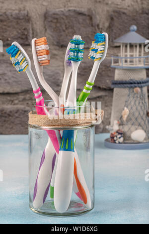 adult and children toothbrushes in glass - family set of toothbrushes ...