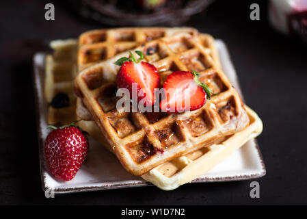 Homemade waffles served with ice cream and strawberry Stock Photo