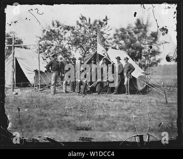 Gen. David McM. Gregg and staff of nine. Recognized - Capt. Admas, Capt. Edward A. Fobes, Lieut. Thomas Gregg, Capt. Albert M. Harper, Asst. Surgeon Nathan E. Marsh, Maj. C. Taylor, Capt. Treichel, Asst. Surgeon Tuft, Capt. Henry C. Weir. Stock Photo