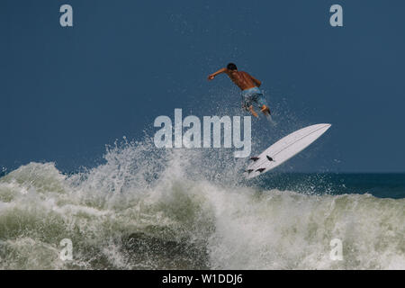 Surfer's crash on the high wave in Bali Stock Photo