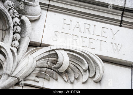 Harley Street, West London, world famous private medical centre road sign in ornate stone Stock Photo