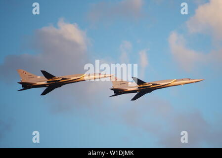 Minsk, Belarus - July 1, 2019 Flight of aircraft over the city, a group of fighters in the sky on Stock Photo