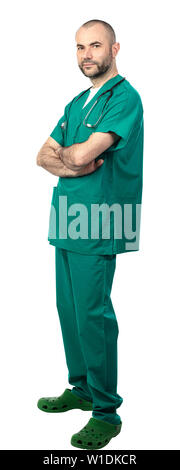 portrait of a doctor with a beard and green uniform with a calm and positive expression. isolated on white. Stock Photo