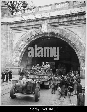 Genoa, Italy. In this newly liberated city the 92nd Division troops enter the Galleria Guiseppe [sic] Garibaldi., 04/27/1945 Stock Photo