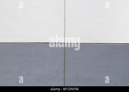 High resolution full frame background of a concrete wall painted in white and gray, 2x2 grid. Stock Photo