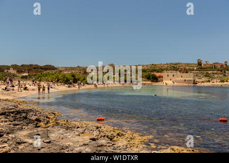 Panorama of the crystal clear blue waters of Santa Maria Beach in Santa Marija Bay, Comino, Malta. Stock Photo