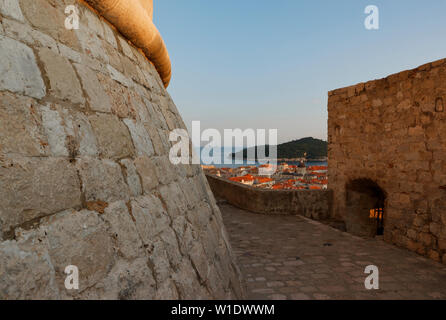 View of city from wall surround showing Minceta tower in warm light from the setting sun,Dubrovnik,Croatia Stock Photo