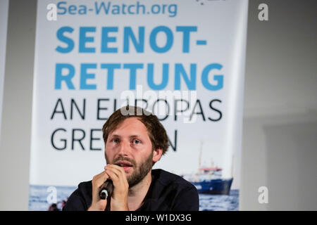 Berlin, Germany. 02nd July, 2019. Ruben Neugebauer, speaker of Sea-Watch, speaks at a press conference about Sea-Watch captain C, who has been arrested in Italy. Rackete. Credit: Christoph Soeder/dpa/Alamy Live News Stock Photo