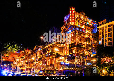 Chongqing, Chongqing, China. 2nd July, 2019. Chongqing, China - July 2 2019: At night, Hong Ya Dong in chongqing is illuminated like a fantasy world in spirited away.Hong Ya Dong is located in cangbai road, jiefangbei, yuzhong district, chongqing, formerly one of the ancient gates of chongqing, with profound historical deposits.In this has formed the jiang pass fortress, the Ming dynasty city wall, the academy legacy and other places of interest, but also for ''hongya dicui'' this wonder was one of the twelve scenes in bayu. Credit: SIPA Asia/ZUMA Wire/Alamy Live News Stock Photo